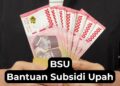 Tangan memegang uang tunai dengan tulisan BSU Bantuan Subsidi Upah 2025