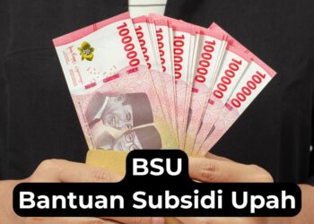 Tangan memegang uang tunai dengan tulisan BSU Bantuan Subsidi Upah 2025