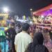 Warga memadati area Festival Pasar Malam yang digelar tanpa izin resmi di Taman HKSN Senen, Jakarta Pusat, Jumat (16/1/2026).