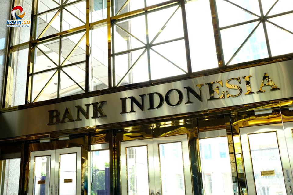 Facade of Bank Indonesia with gold-framed glass doors and a metal sign reading BANK INDONESIA