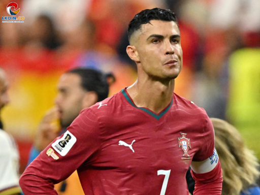 Portugal captain Cristiano Ronaldo in Portugal's red jersey (number 7) on the soccer field during a match, with a focused expression.